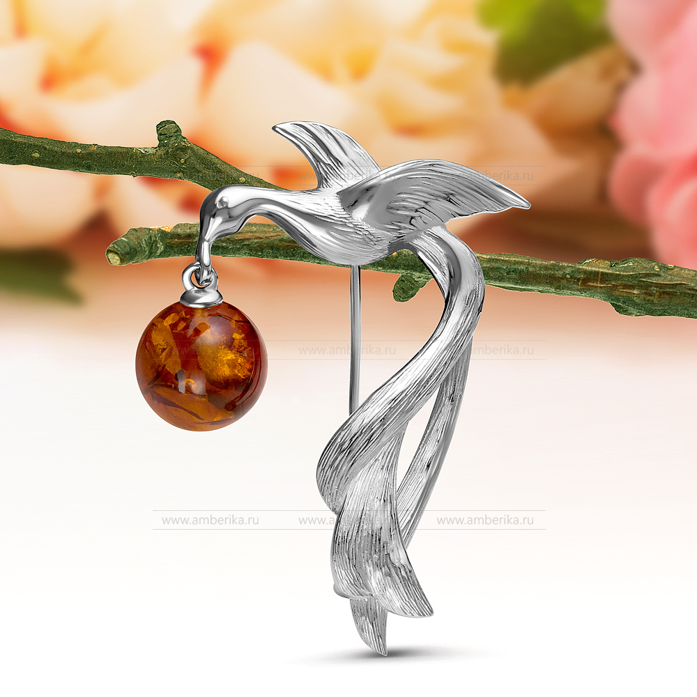 Брошь "Птица" из серебра 925 пробы с коньячным балтийским янтарем, артикул 10940